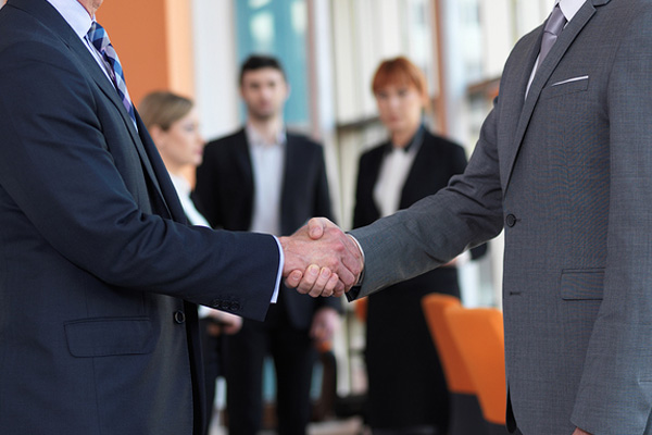 two businessmen shaking hands